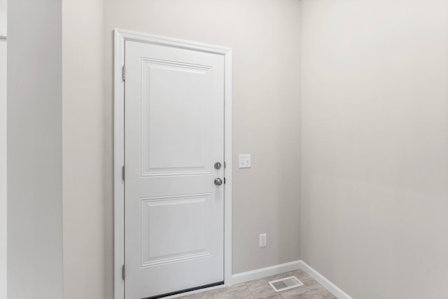 doorway featuring light tile patterned floors