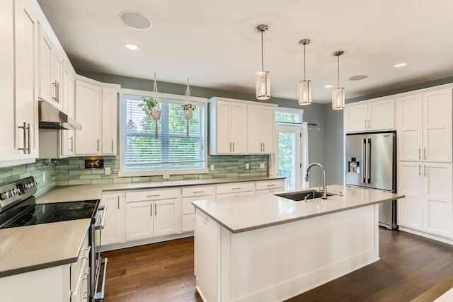 kitchen with dark wood-type flooring, sink, backsplash, and stainless steel appliances