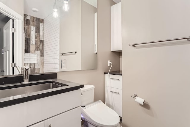 bathroom with vanity and toilet