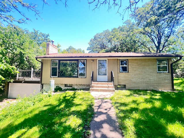 view of front of property with a garage and a front yard