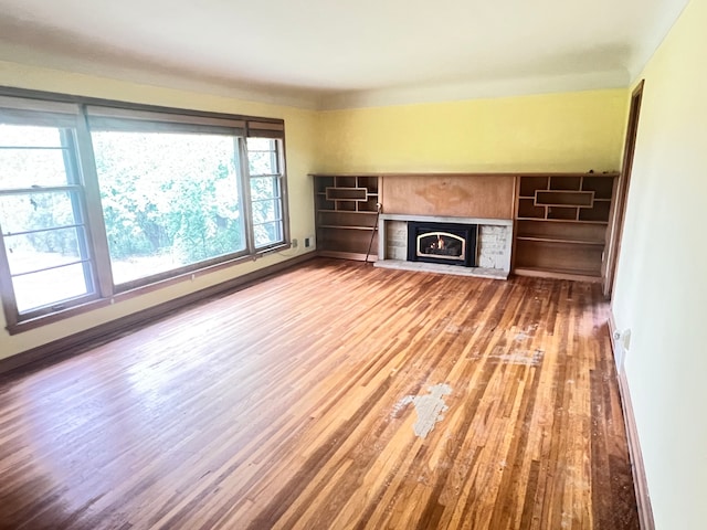 unfurnished living room featuring hardwood / wood-style floors