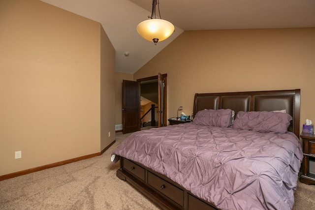 carpeted bedroom featuring vaulted ceiling