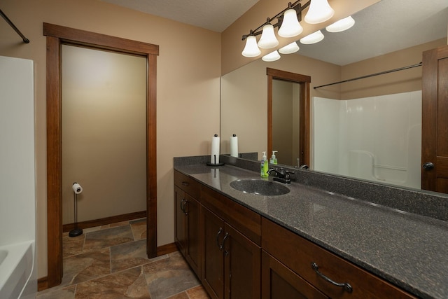 bathroom with shower / bath combination and vanity