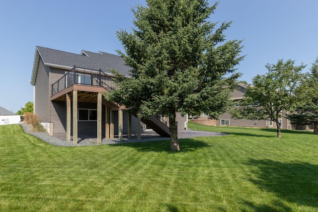 rear view of property with a lawn