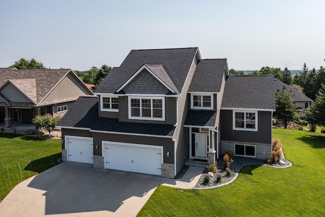 view of front of property with a shingled roof, a front yard, a garage, stone siding, and driveway