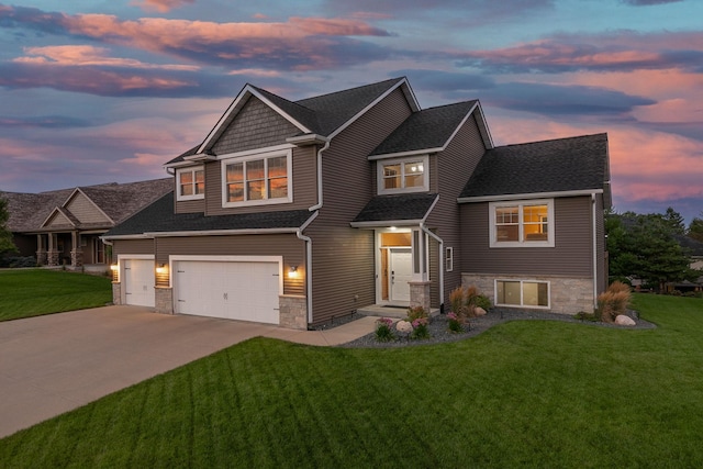 view of front of house featuring roof with shingles, a garage, stone siding, driveway, and a front lawn