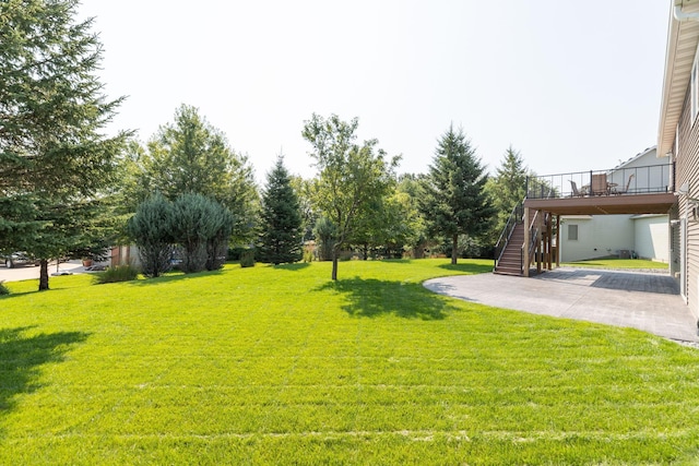 view of yard with a wooden deck