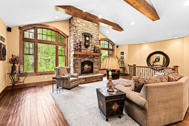 living area with lofted ceiling with beams, a fireplace, recessed lighting, baseboards, and wood finished floors