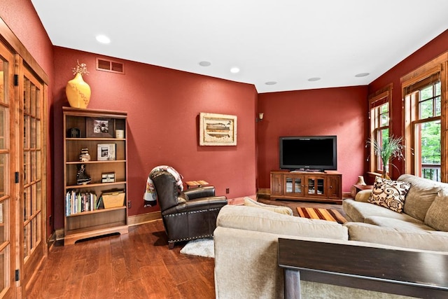living area featuring visible vents, recessed lighting, dark wood finished floors, and baseboards