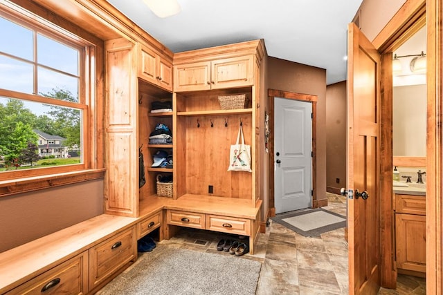 mudroom with stone finish flooring
