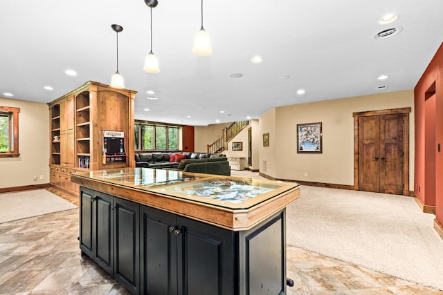 kitchen with a healthy amount of sunlight, baseboards, recessed lighting, and open floor plan