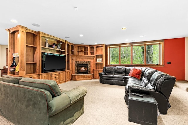 carpeted living area featuring recessed lighting and a high end fireplace