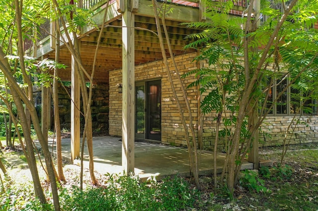 view of side of home with a patio area