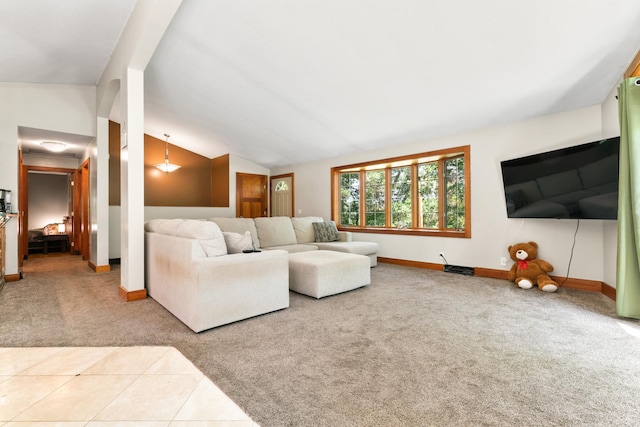 living room with lofted ceiling and carpet floors