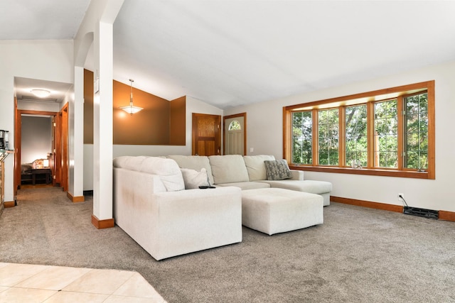 tiled living room featuring carpet flooring, vaulted ceiling, and baseboards