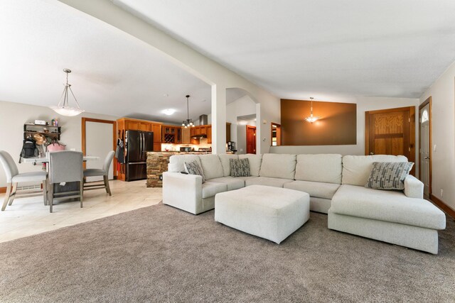 tiled living room with lofted ceiling