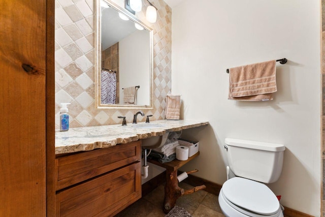 bathroom with walk in shower, vanity, toilet, and tile patterned floors