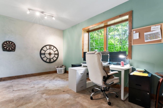 office space with baseboards