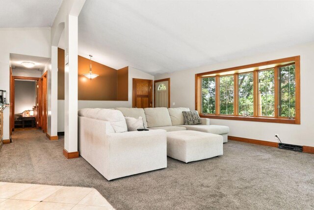 living room featuring carpet and lofted ceiling