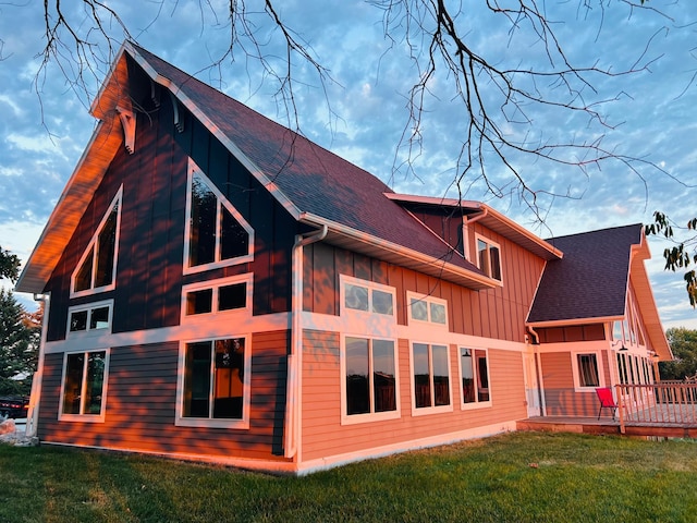 rear view of house with a yard