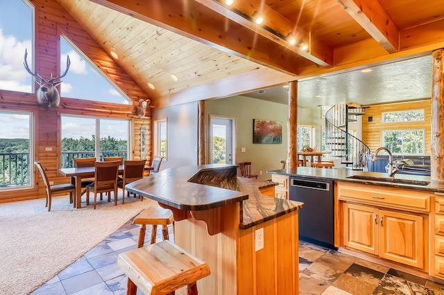 kitchen with dishwasher, sink, light tile patterned floors, and a wealth of natural light