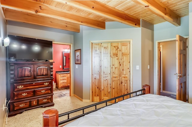 bedroom featuring wood ceiling, tile patterned flooring, and beam ceiling