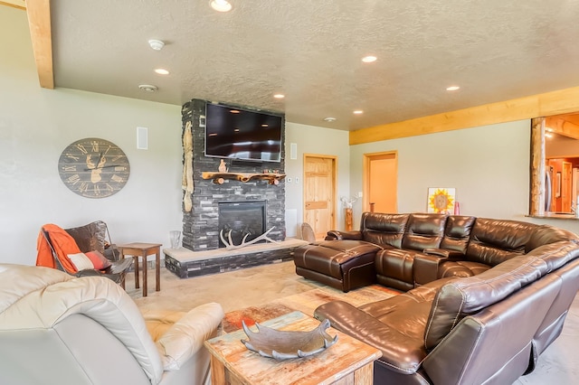 living room with a fireplace and a textured ceiling