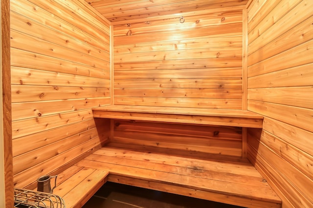 view of sauna / steam room with wood walls and wooden ceiling