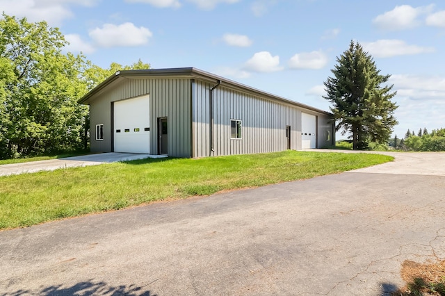 garage featuring a lawn