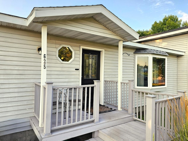 entrance to property with a wooden deck