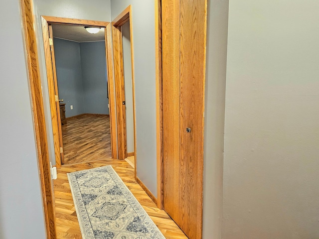 hall with light wood-type flooring