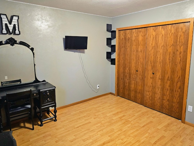 office with light wood-type flooring