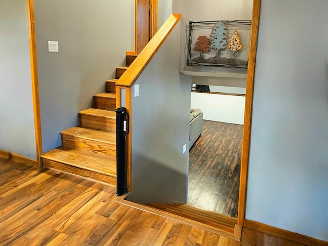 stairway featuring hardwood / wood-style floors