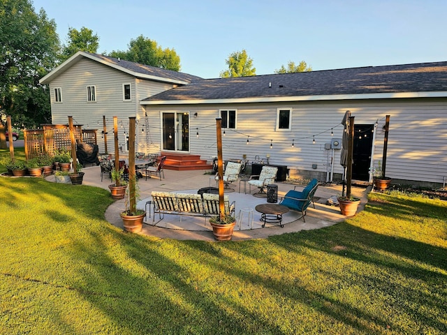 back of house with a yard and a patio area