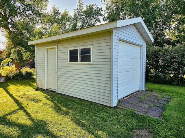 view of outdoor structure with a yard