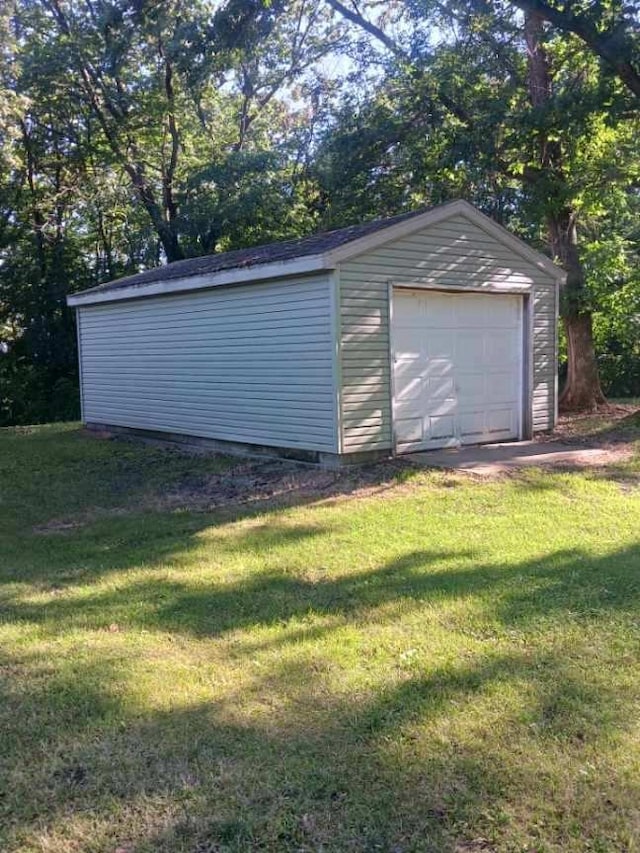 garage featuring a yard