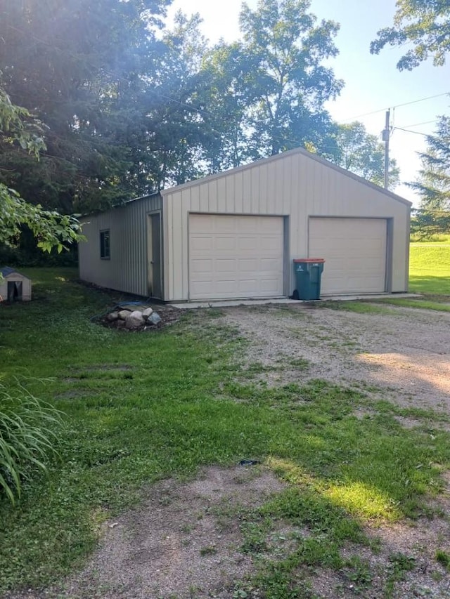 garage with a yard