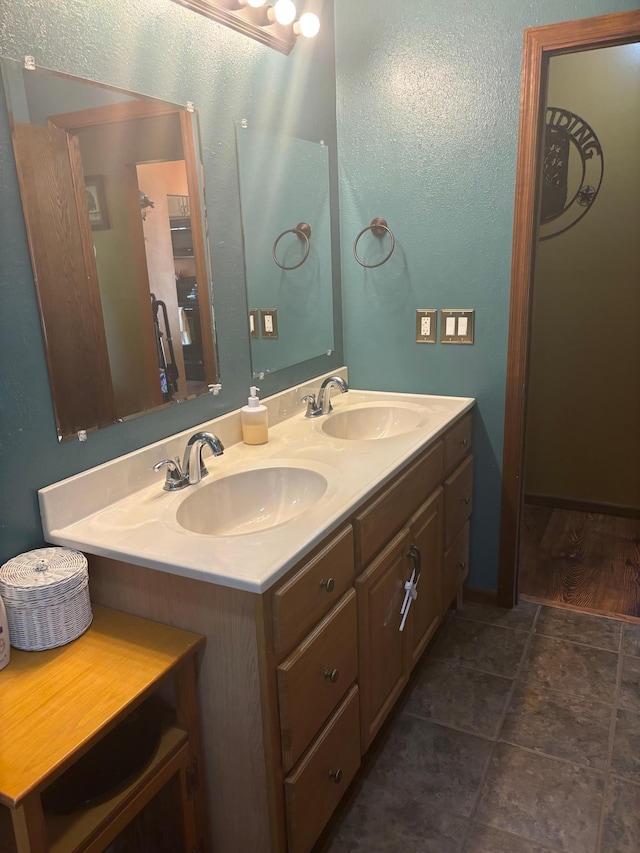 bathroom with tile patterned flooring and vanity