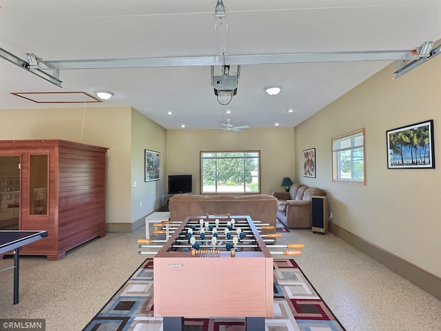 recreation room with recessed lighting, baseboards, and speckled floor