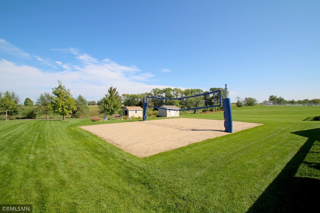 surrounding community featuring a yard and volleyball court