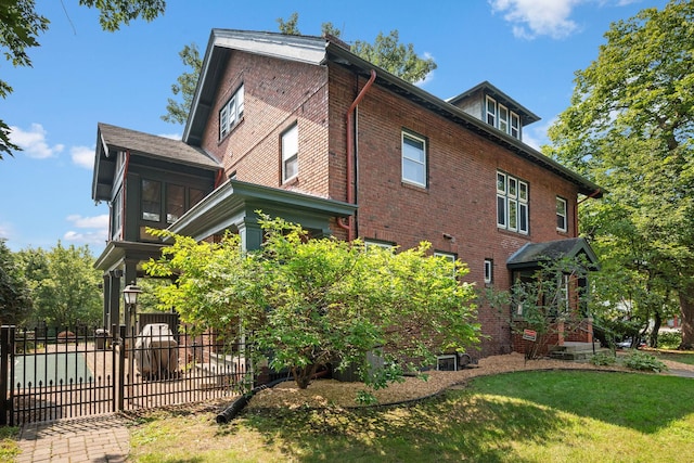 view of home's exterior with a yard