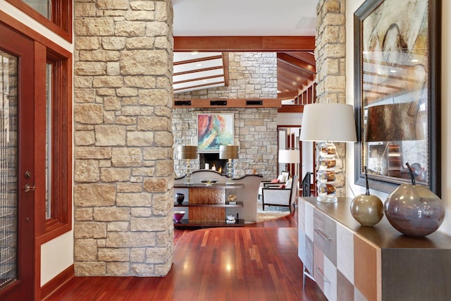 interior space with vaulted ceiling with beams and hardwood / wood-style flooring