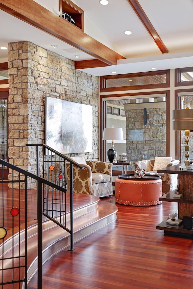 interior space with beamed ceiling and hardwood / wood-style flooring