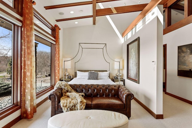 bedroom with carpet and high vaulted ceiling