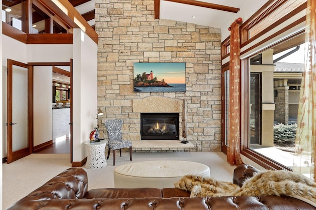 living room with high vaulted ceiling, carpet, beamed ceiling, and a fireplace