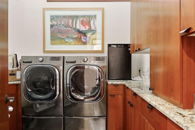 laundry area with cabinets and independent washer and dryer