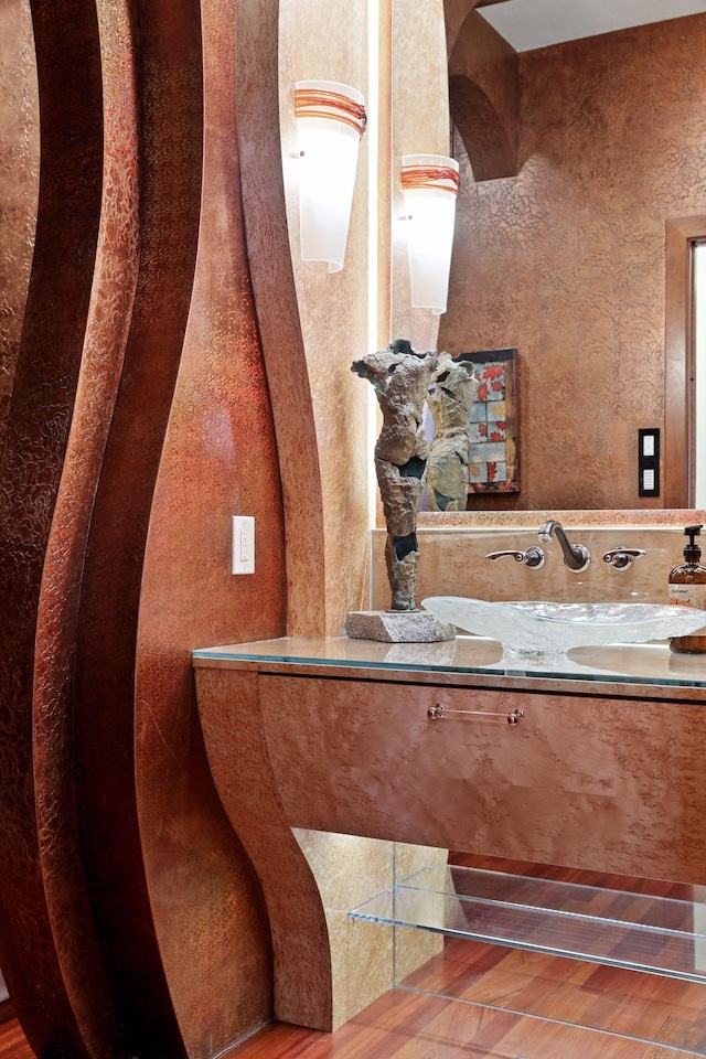 bathroom featuring vanity and hardwood / wood-style flooring