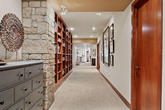 hallway with light carpet