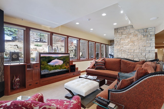 living room with carpet and a fireplace