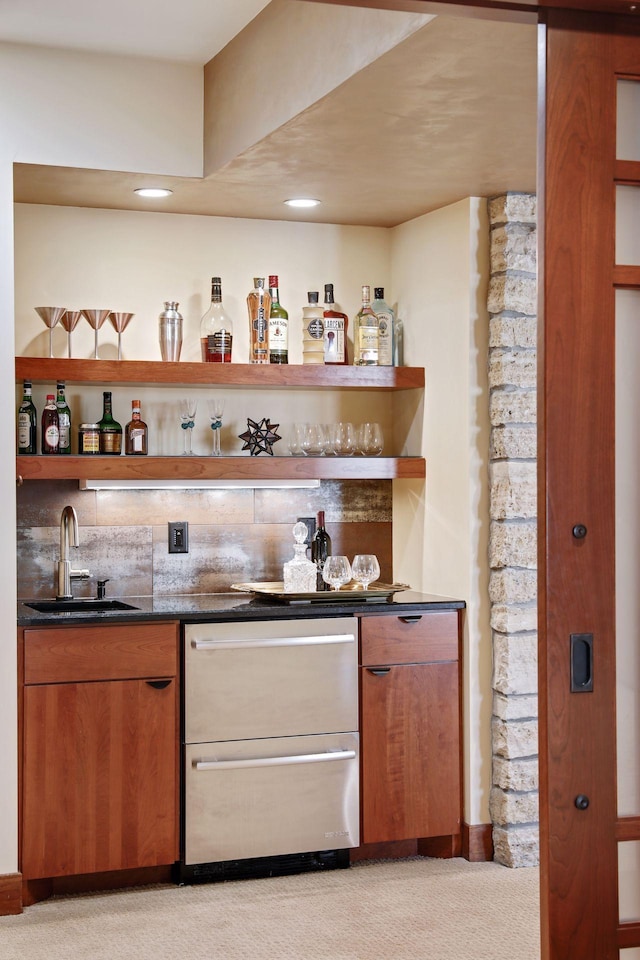 bar featuring light carpet, dishwasher, and sink